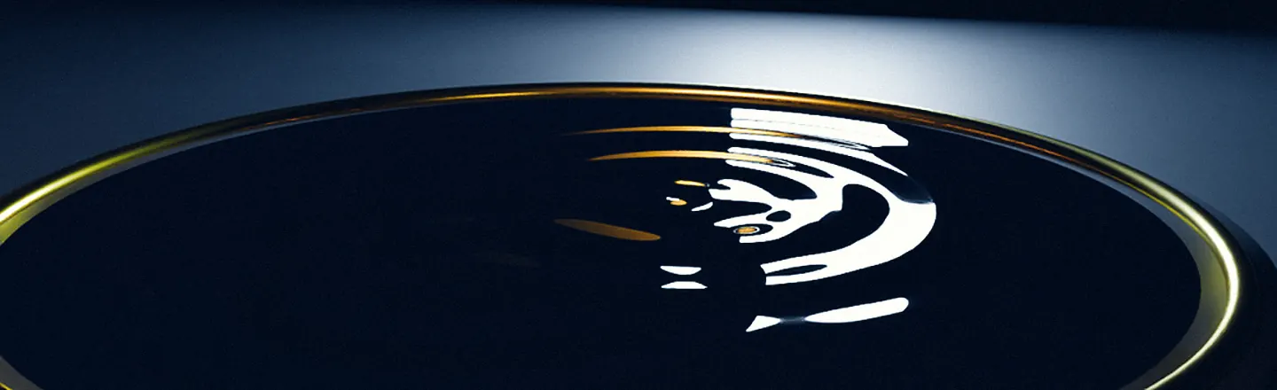 Rings spreading across dark water inside a brass ring